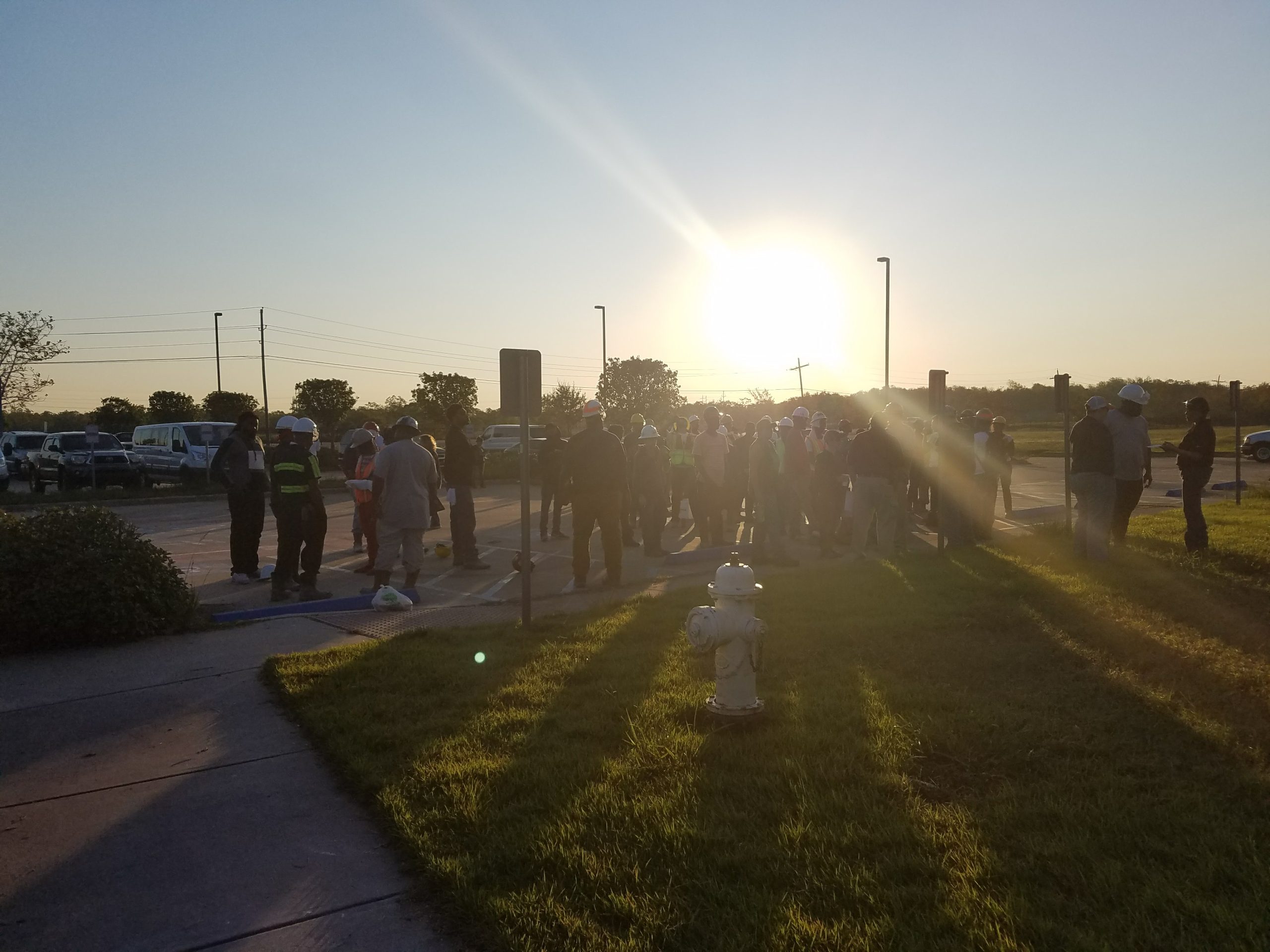 restoration workers gathered outside Port Arthur School District